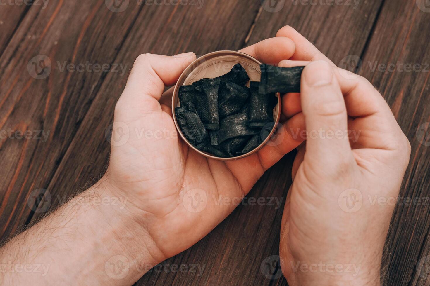 Exploring the unique taste of flavored licorice treats at a cozy gathering photo