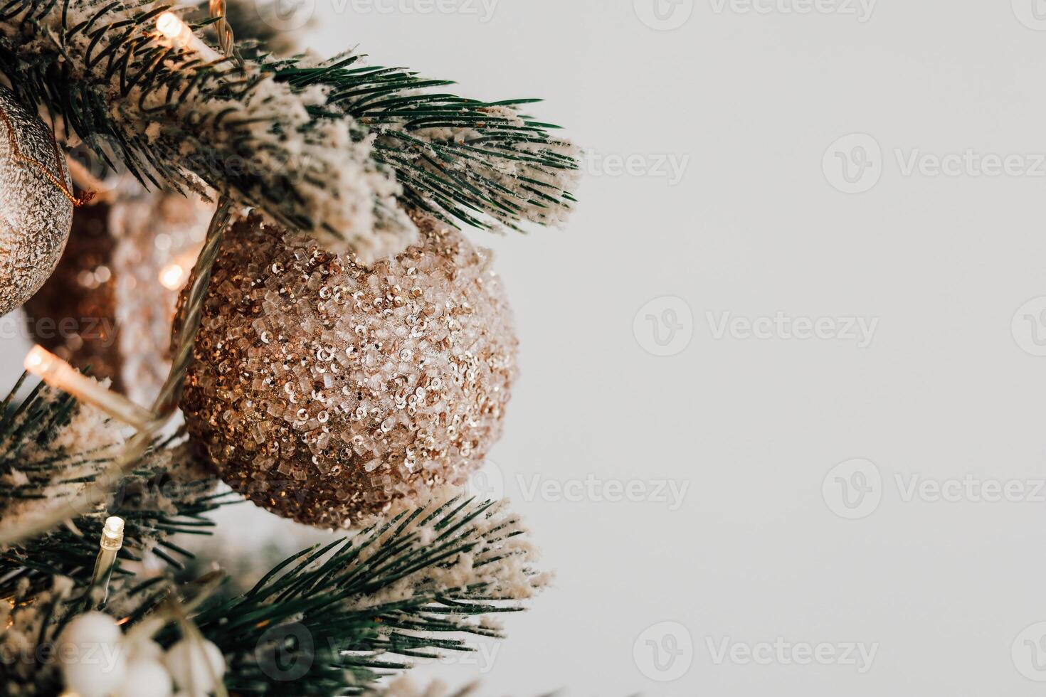 Decorative Christmas ornament hanging on a tree branch during winter season celebration photo