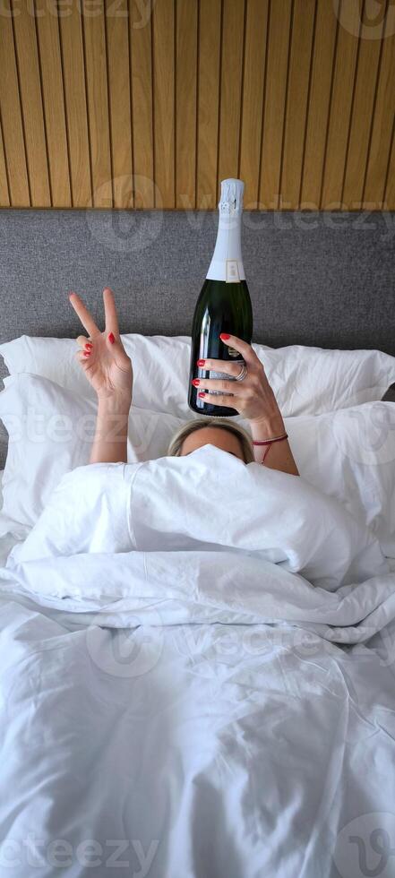 Festive morning with champagne in bed photo