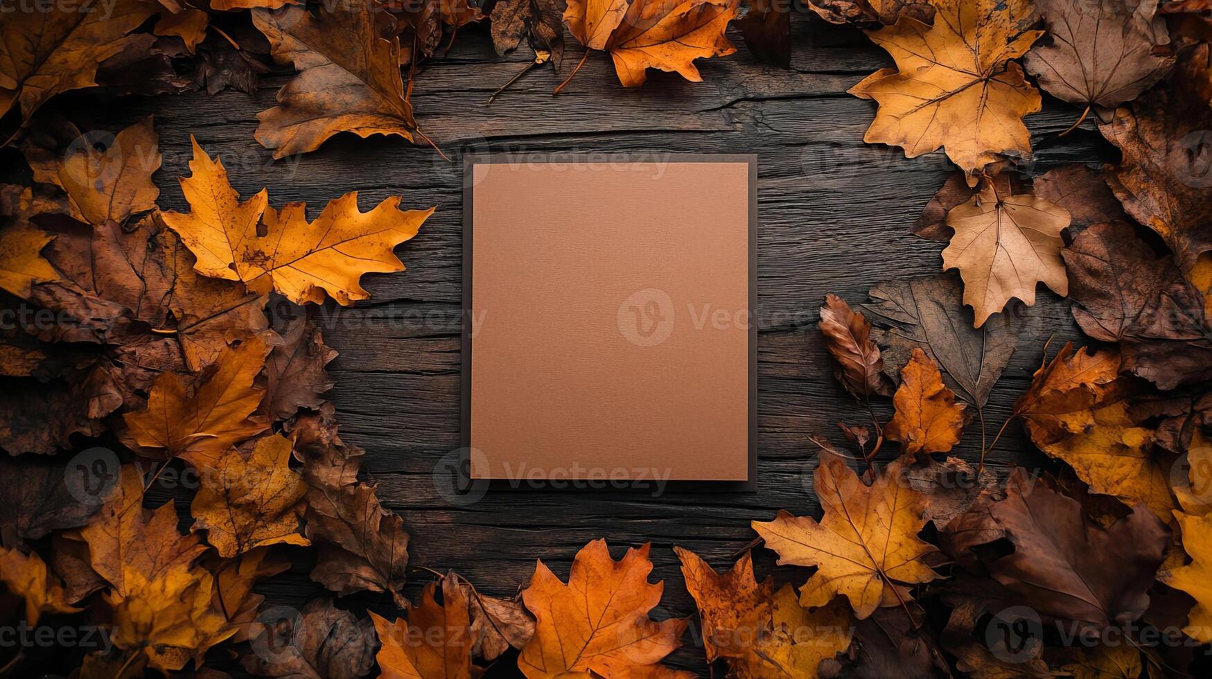 Autumn Leaves Frame with Blank Brown Paper Card on Rustic Wood Background photo