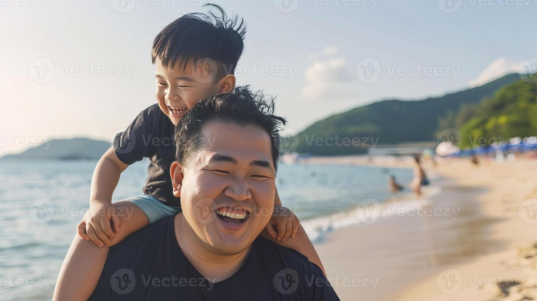 Happy Asian Father and Son Enjoying Beach Vacation photo