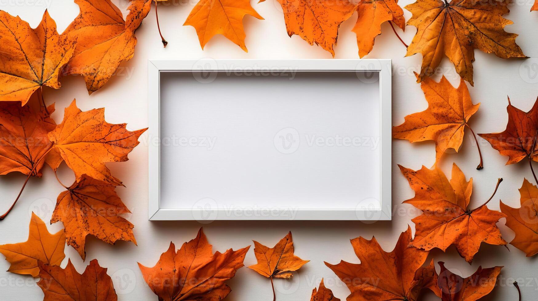 White Frame Surrounded by Autumn Leaves Mockup for Fall Greeting Card Design photo