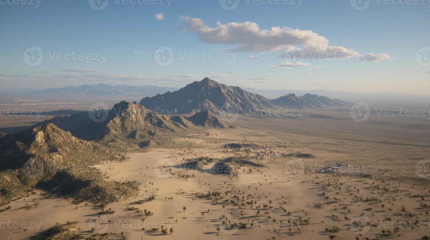 Aerial View of a Desert Canyon with Rippling Sand and Mountain Range photo