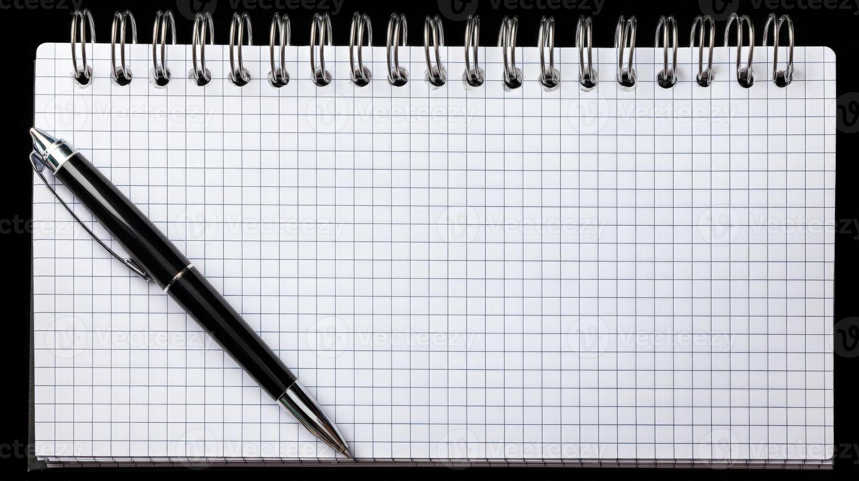 Minimalist Flatlay of Office Supplies Black Pen on Grid Notebook photo