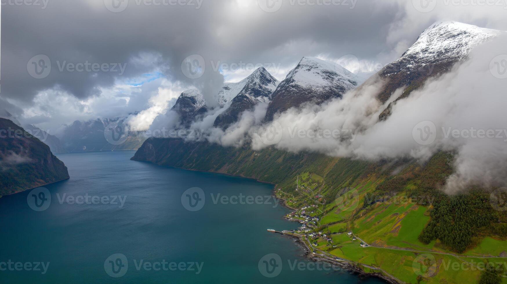 Aerial View of Serene Fjord with Steep Cliffs and Cloudy Sky photo