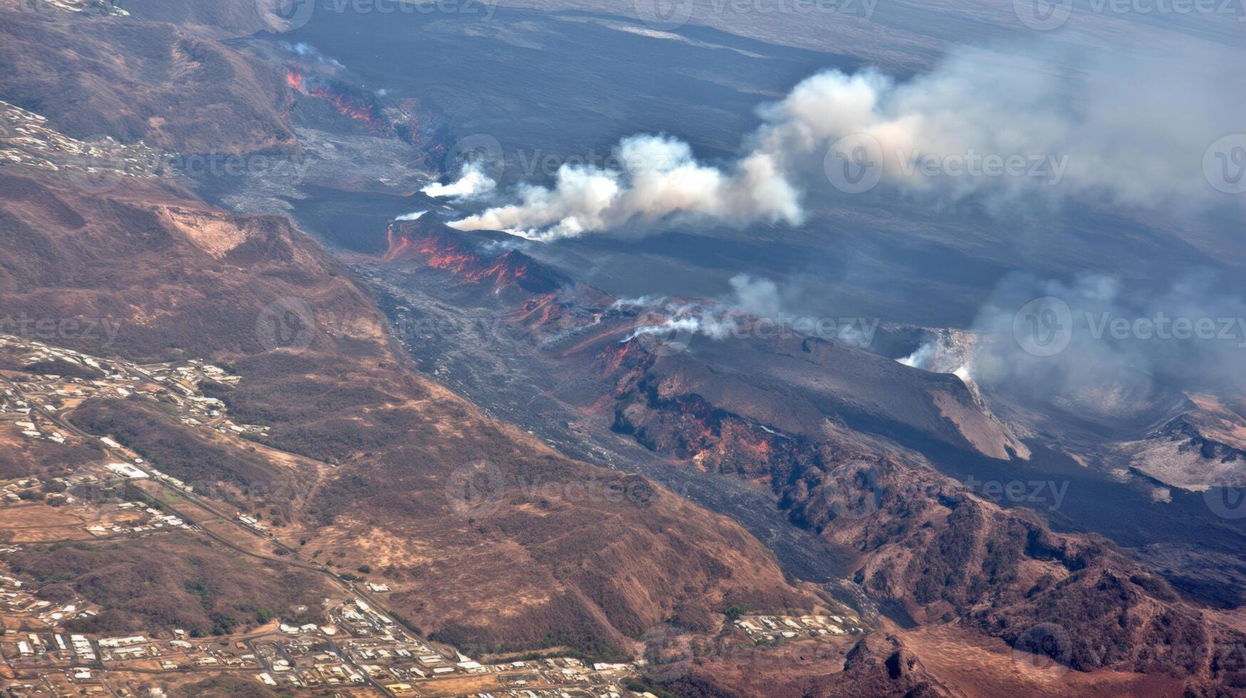 Aerial View of Volcanic Crater with Steam and Smoke Plumes photo