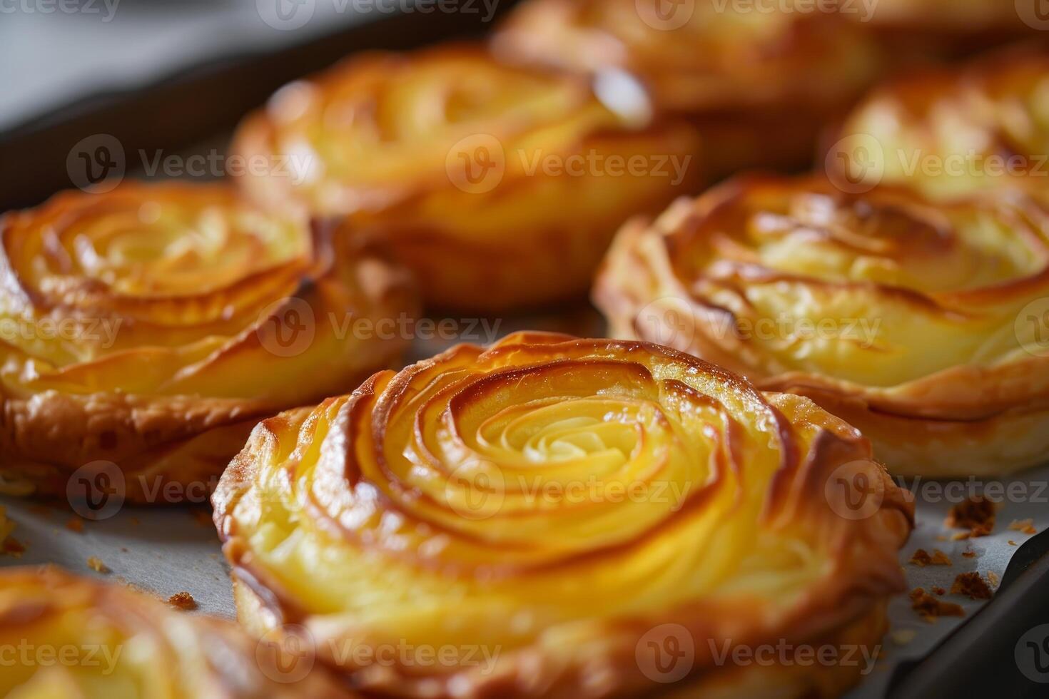 Duchess potatoes forming a rose shape baking on a tray photo