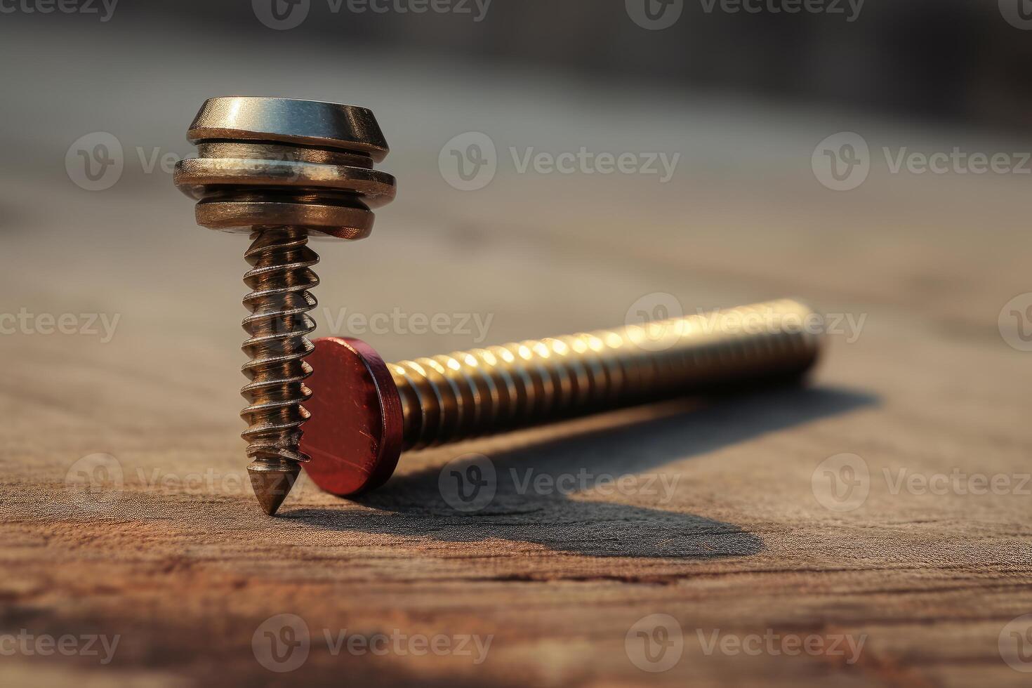 Roofing screw with sealing washer standing on wooden plank photo