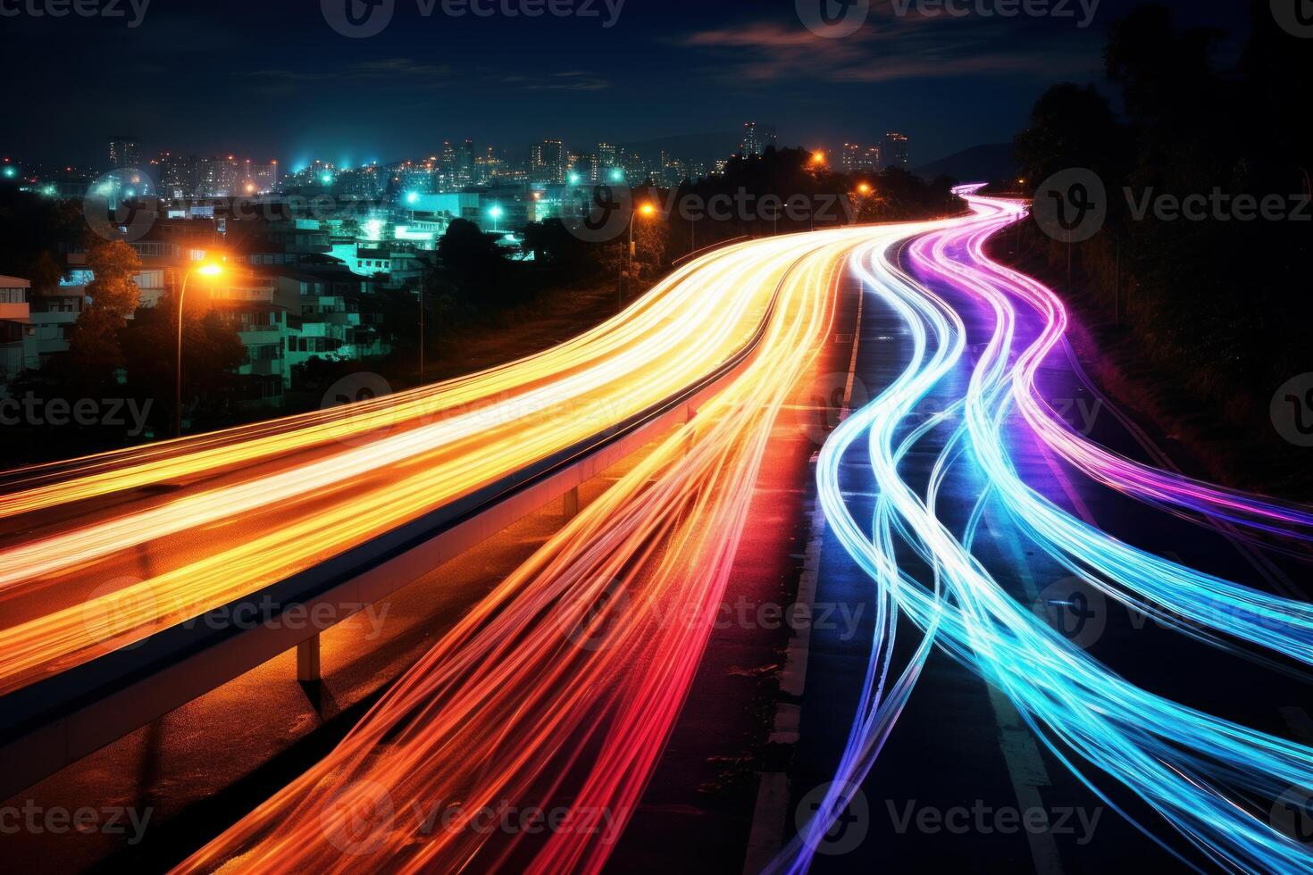 Colorful light trails streaking across a busy highway at night photo