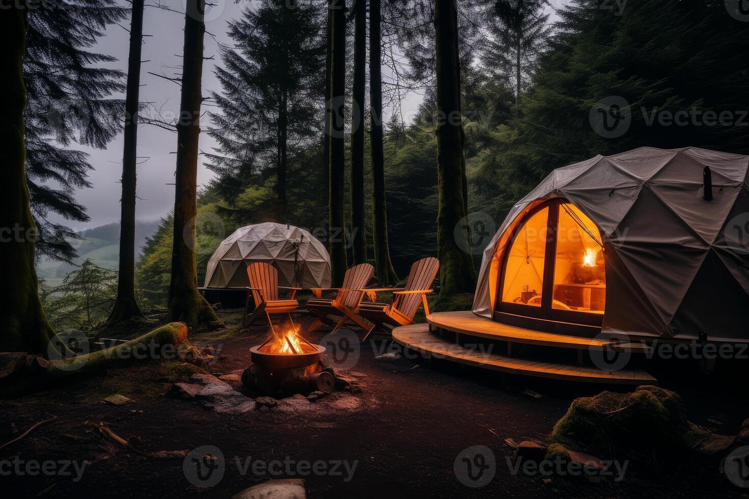 Cozy geodesic dome tents illuminated at twilight in a serene forest camping site photo