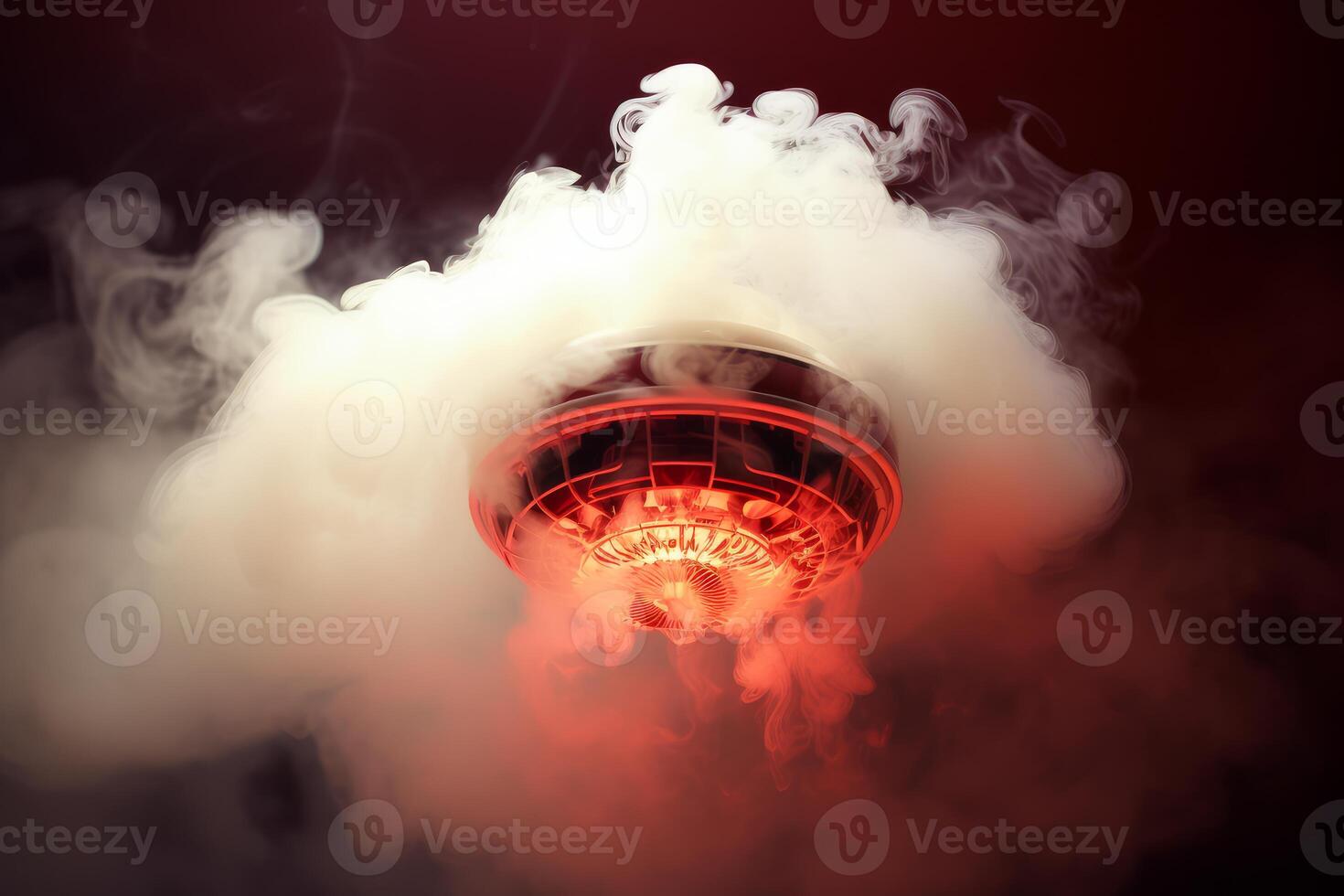 Smoke detector sensing smoke and triggering alarm in home ceiling photo