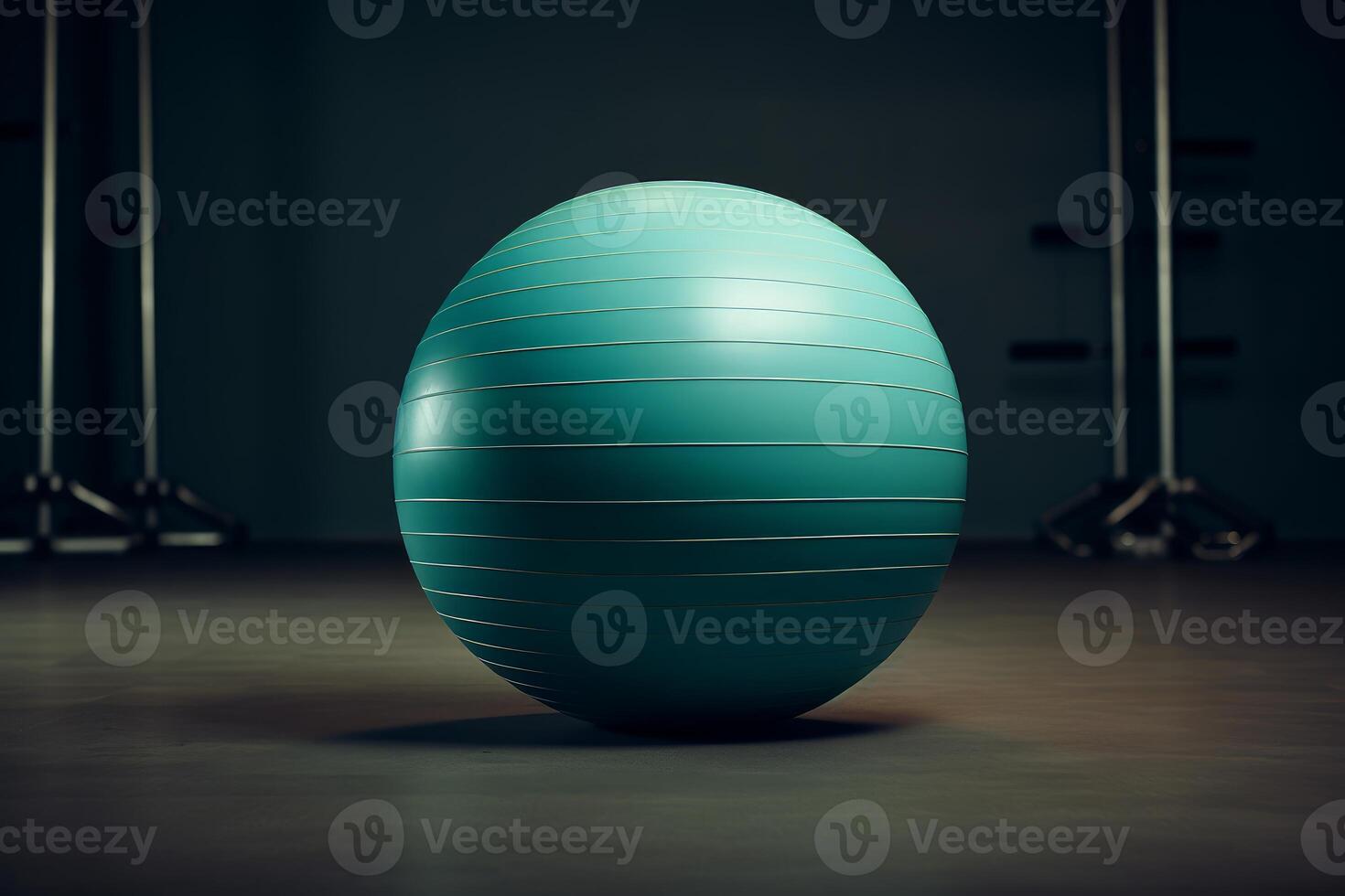 Large teal exercise ball sitting on floor in empty gym photo