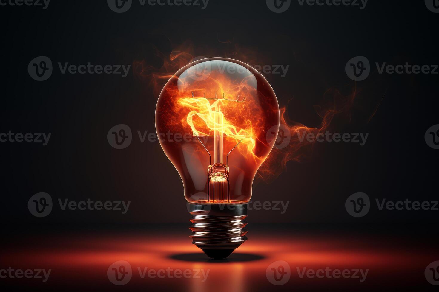 Light bulb burning with inner fire creating energy and power photo