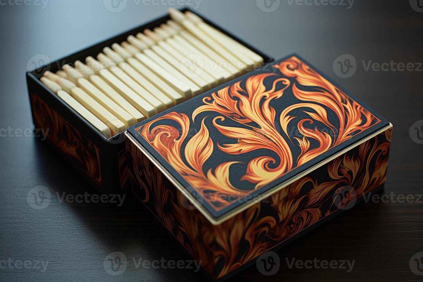 Luxury matches in ornate box resting on dark wooden table photo