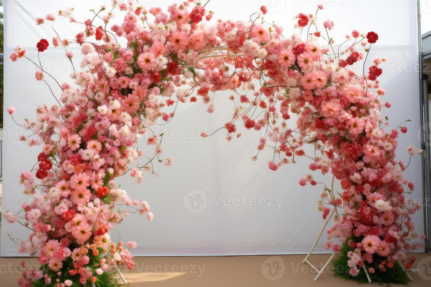 Beautiful floral arch creating stunning backdrop for wedding ceremony photo