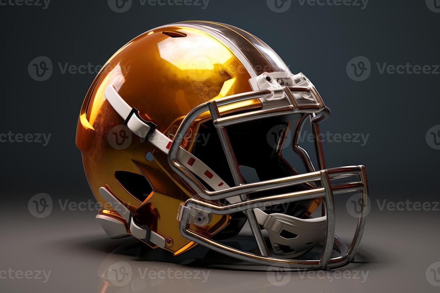 Golden football helmet resting on gray surface with dark background photo