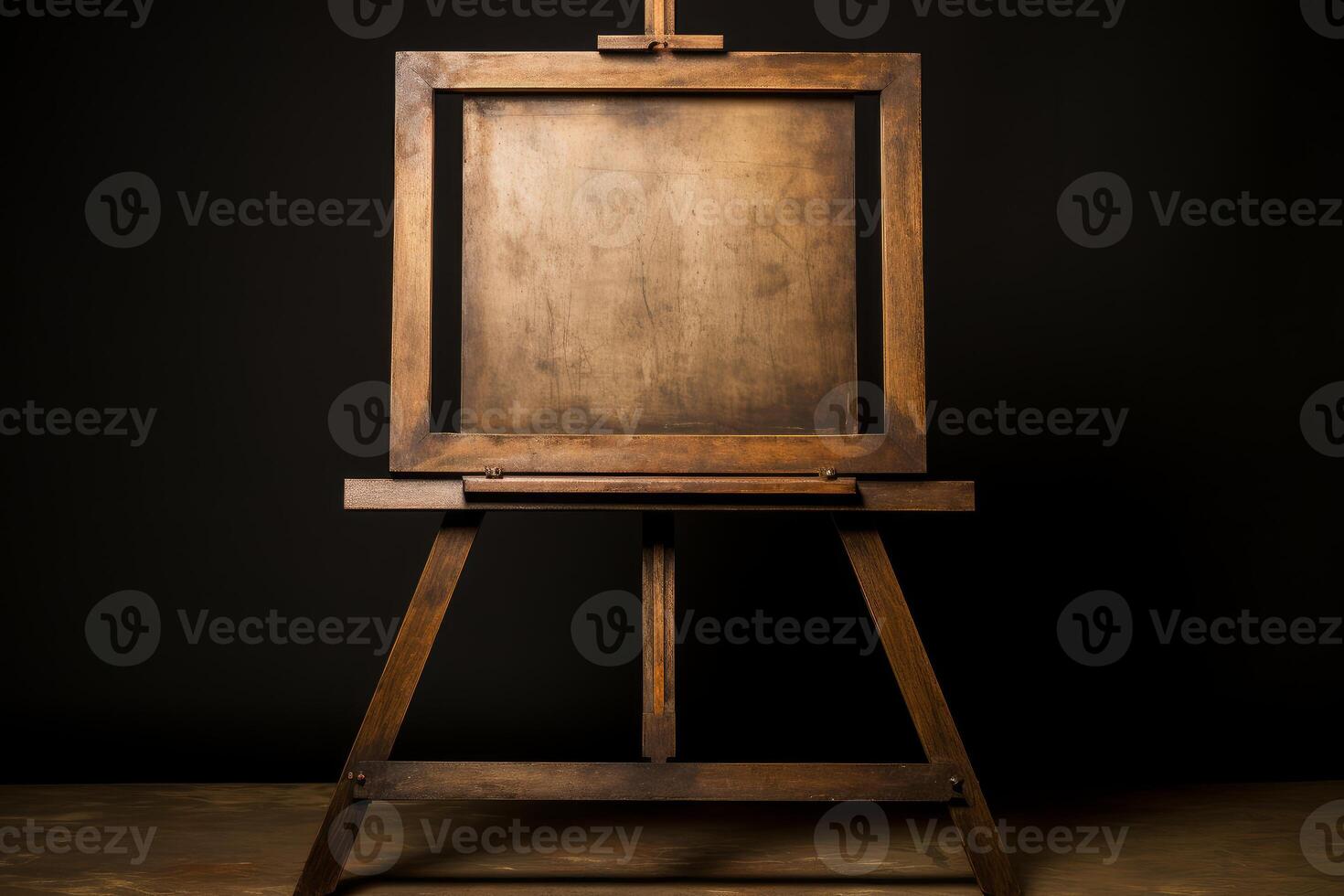 Old wooden easel holding empty canvas on dark background photo