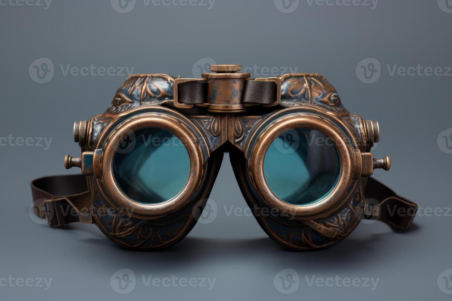 Steampunk goggles resting on a gray background photo