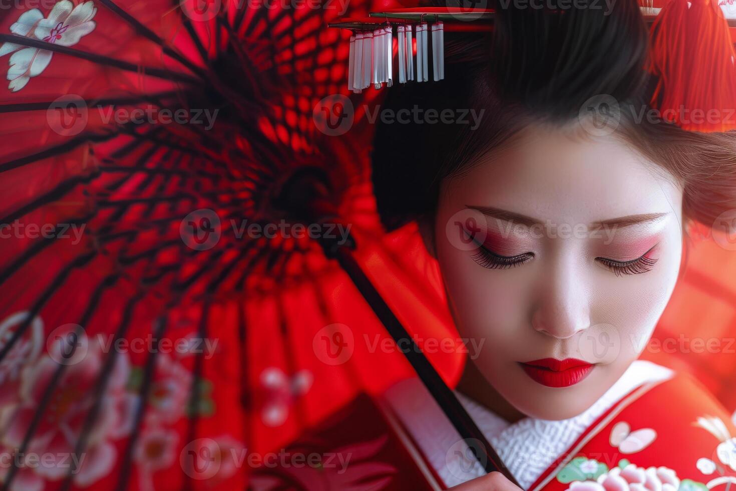 Japanese woman with traditional makeup and red umbrella posing for photo