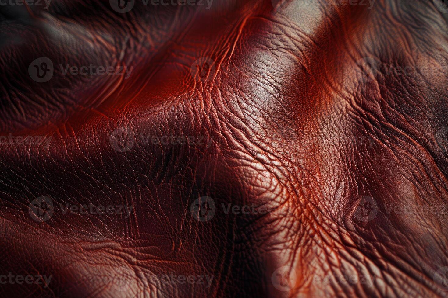 Close up of crumpled red leather showing texture and detail photo