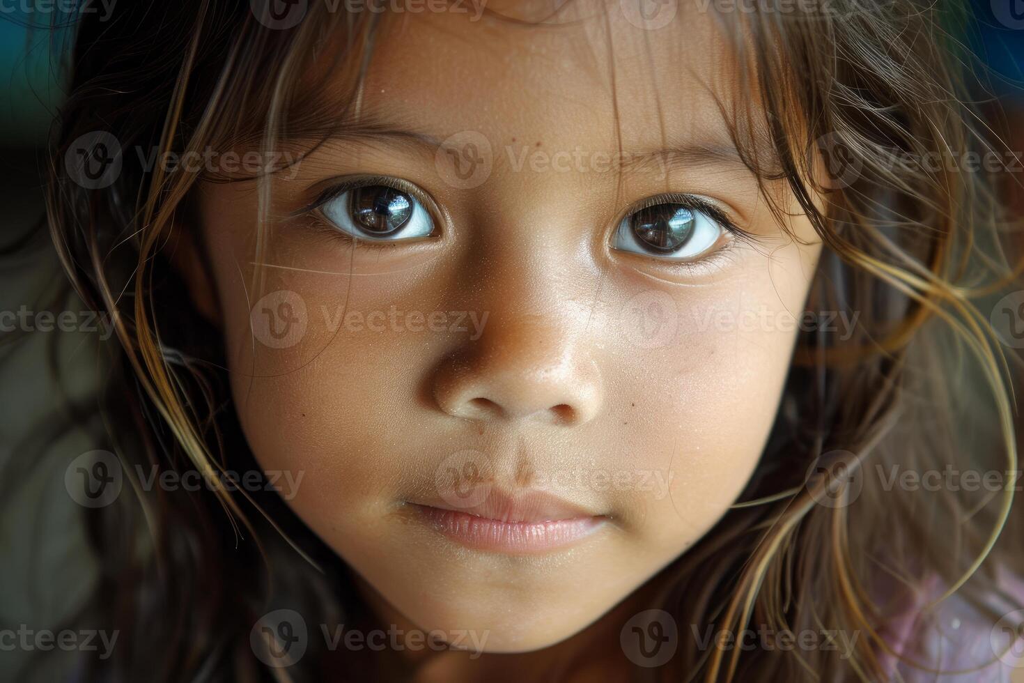 Portrait of young girl expressing seriousness and hope photo