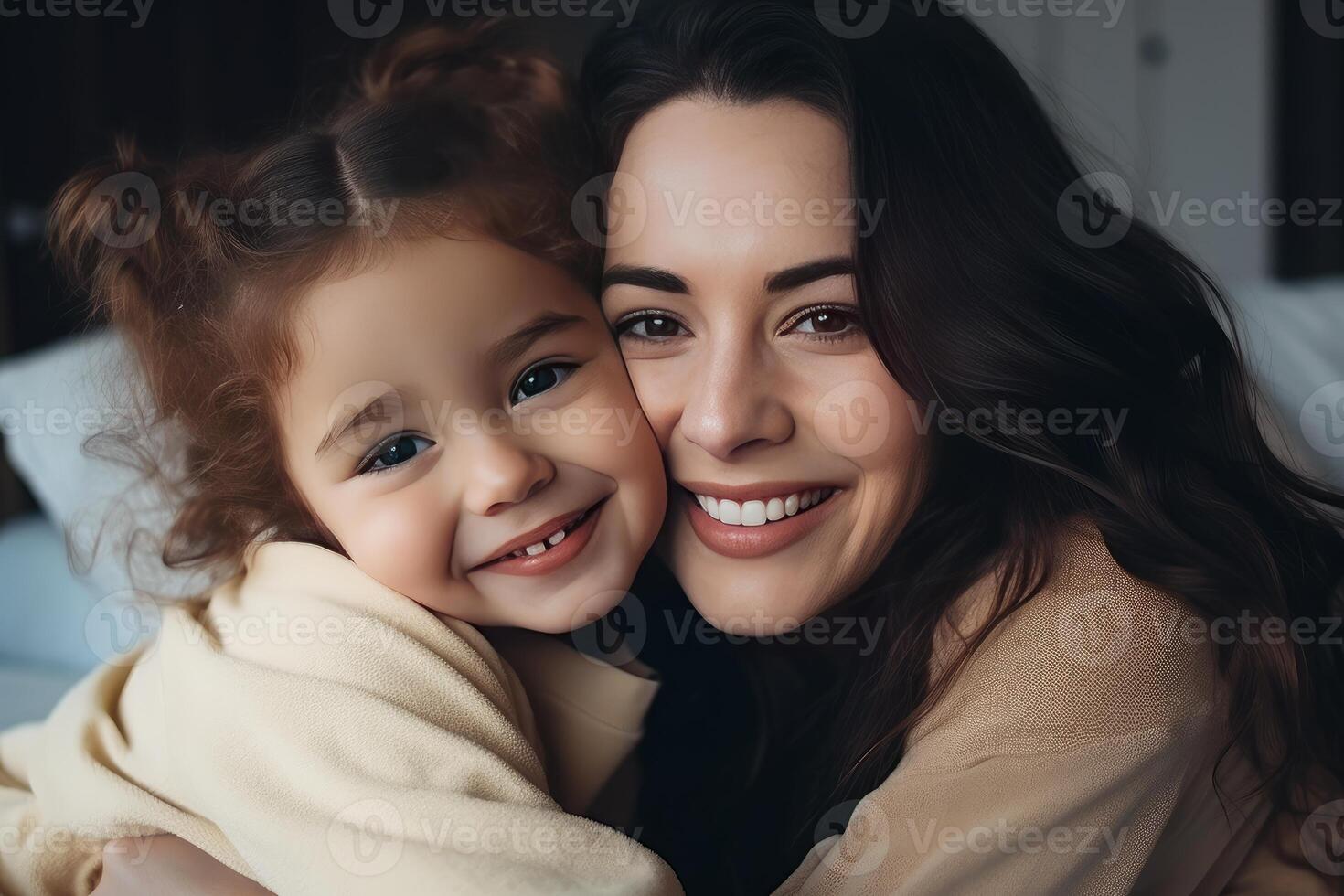 A woman and a little girl are smiling for the camera photo
