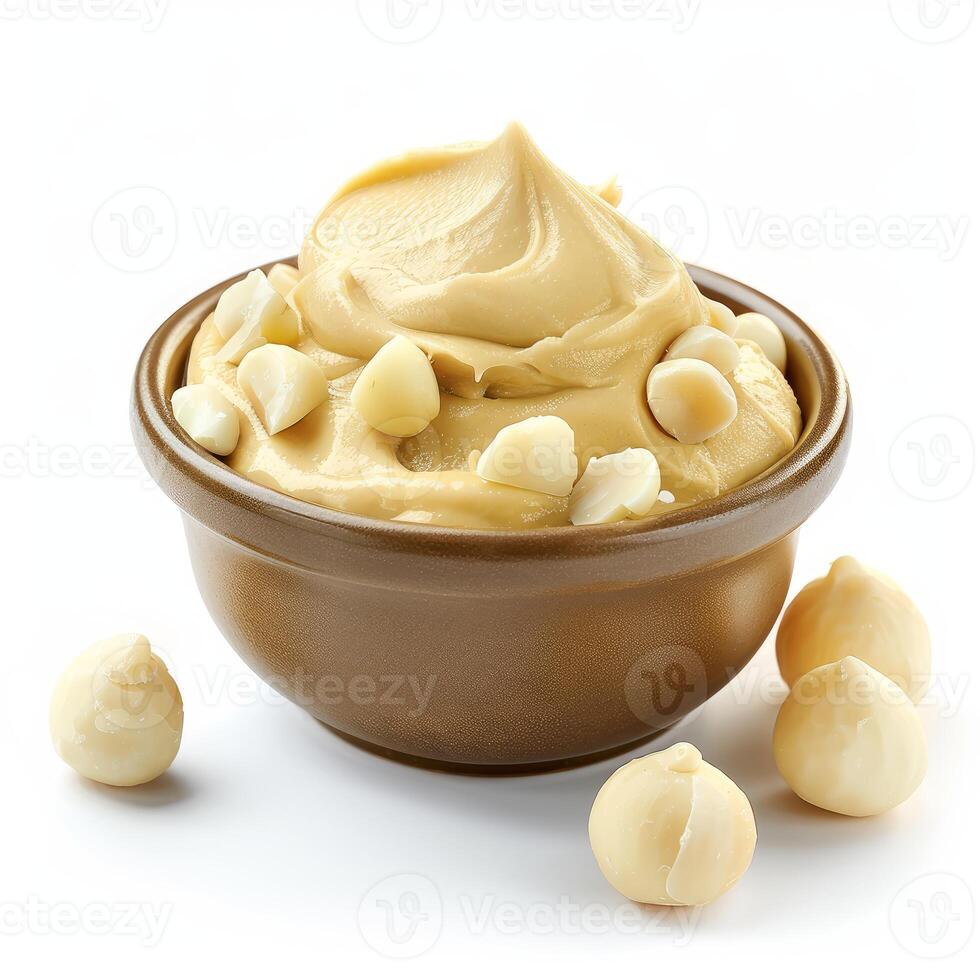 Macadamia nut butter in bowl with macadamia nuts topping photo