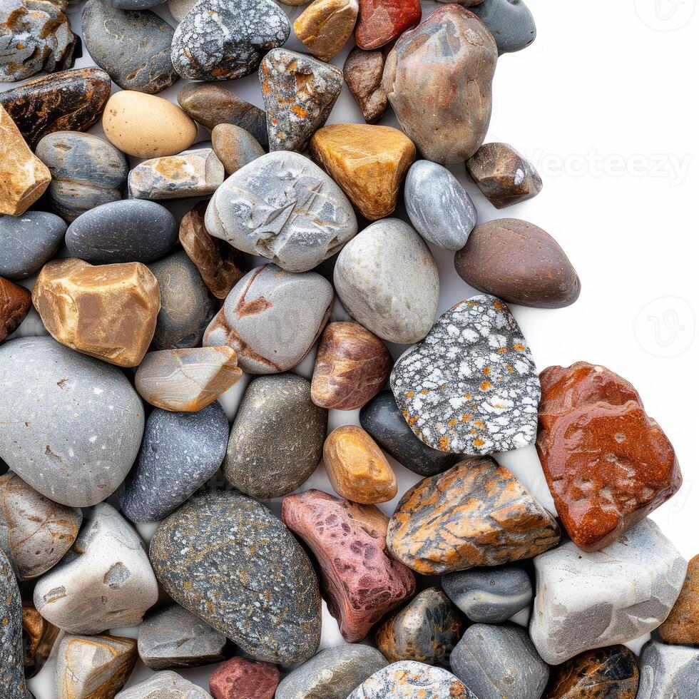 Colorful pebbles forming a diagonal line on white background photo