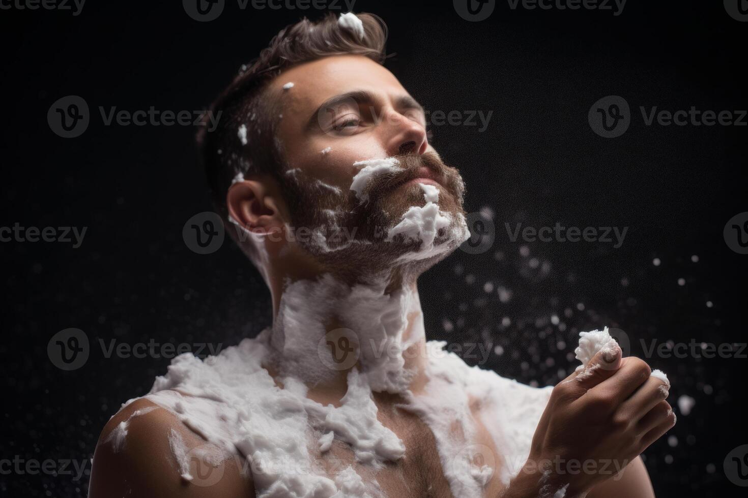Caucasian man covered in shaving cream, preparing for his shaving routine photo