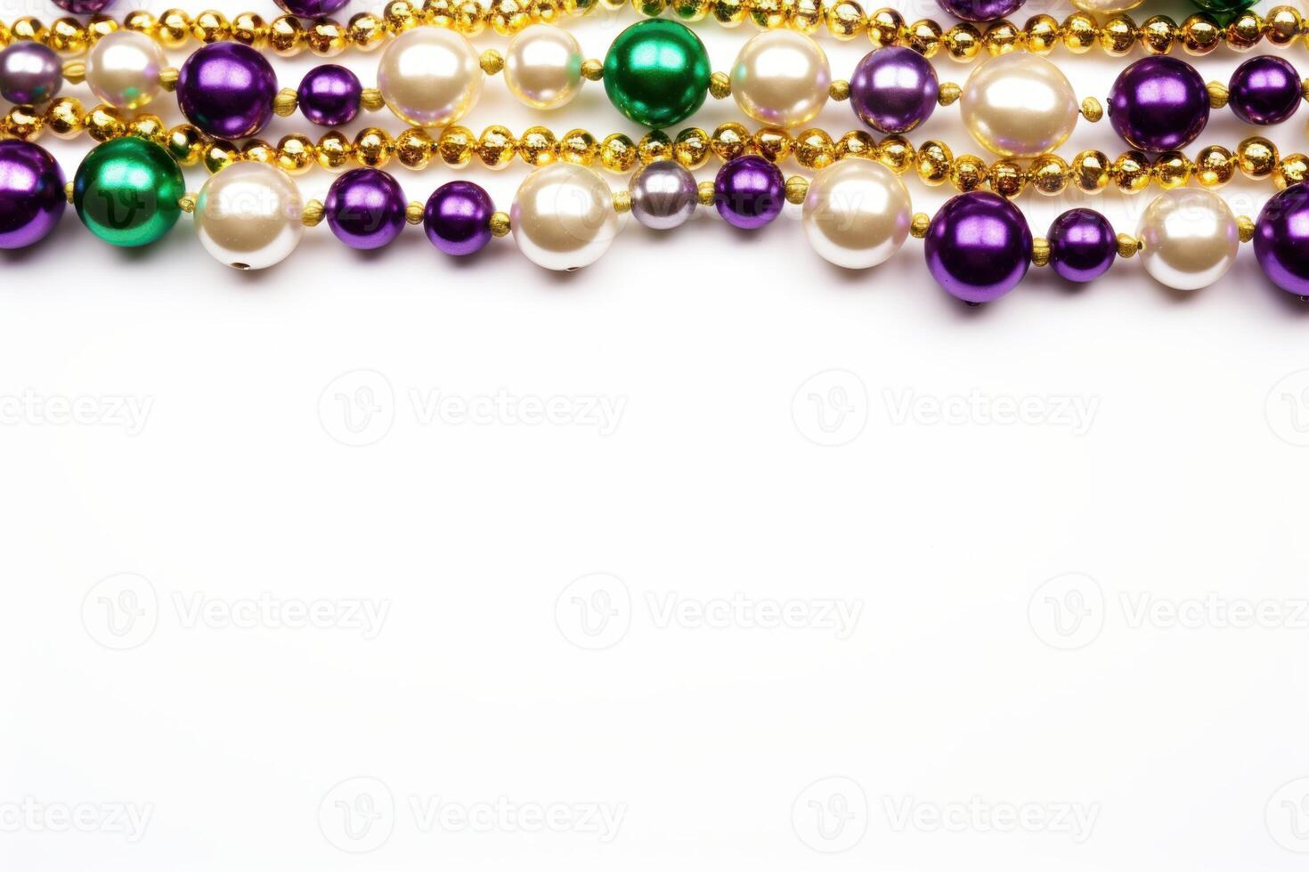 Mardi gras beads forming a border on white background photo