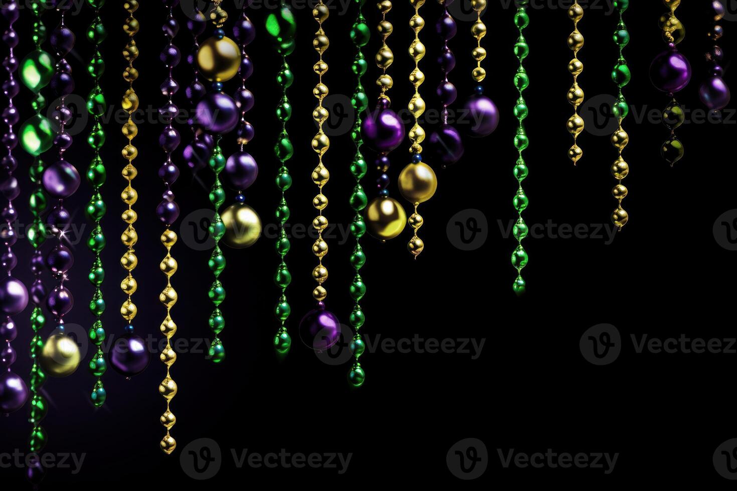 Mardi gras beads hanging on black background creating festive atmosphere photo