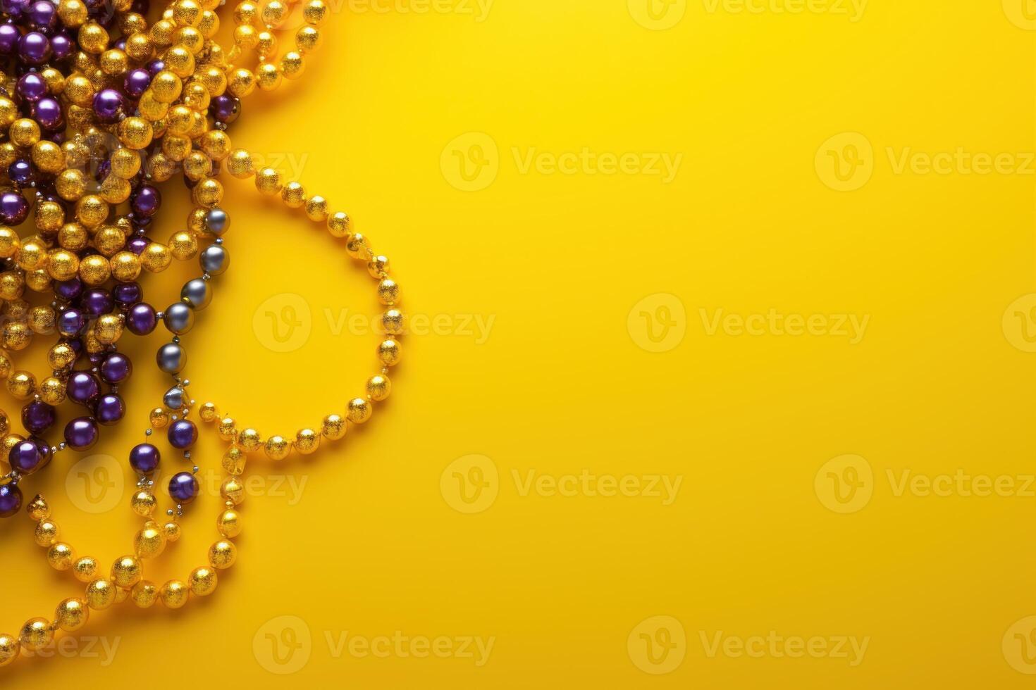 Mardi gras beads on yellow background creating festive atmosphere photo