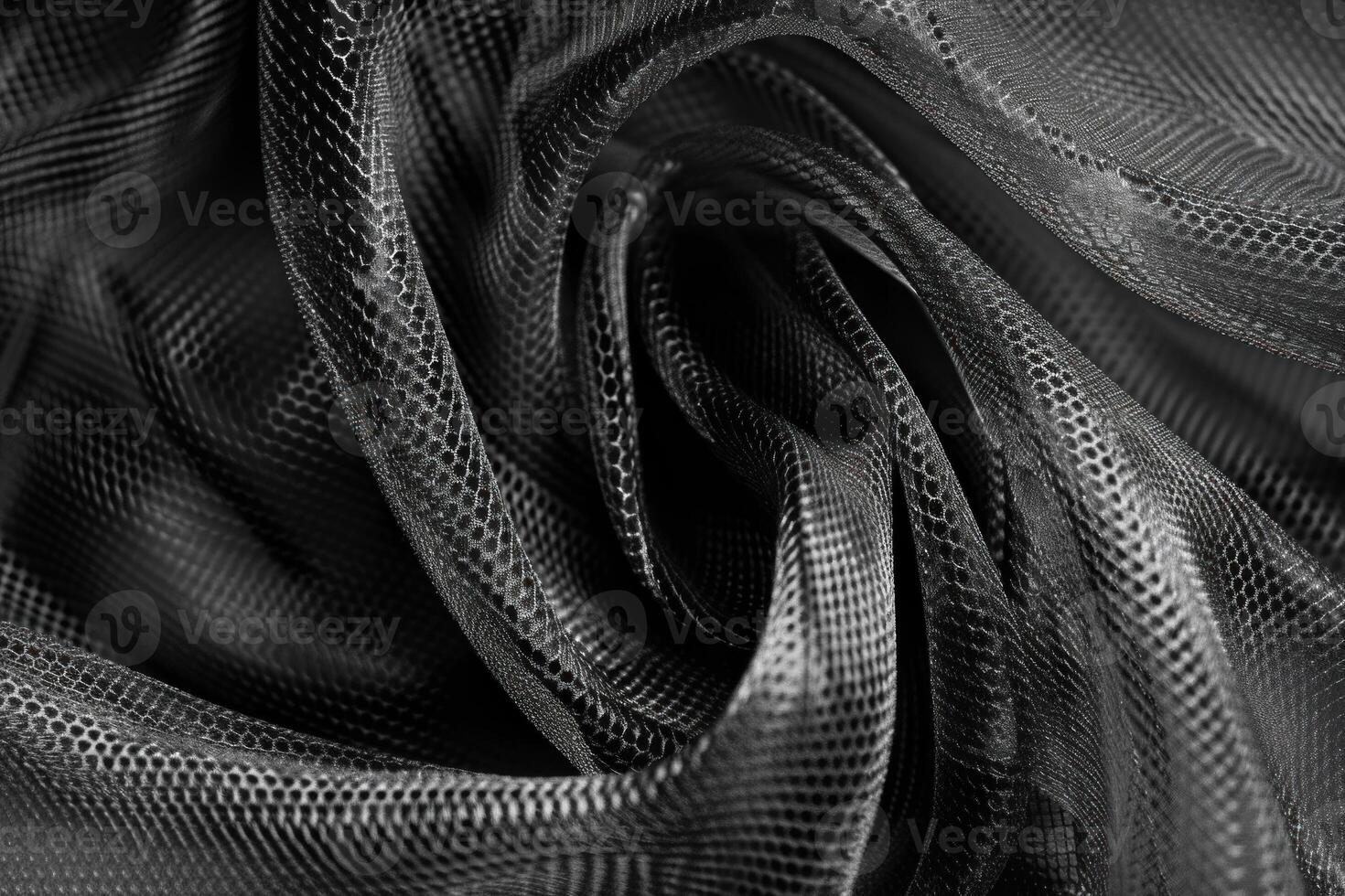 Black mesh fabric forming an elegant swirl pattern photo