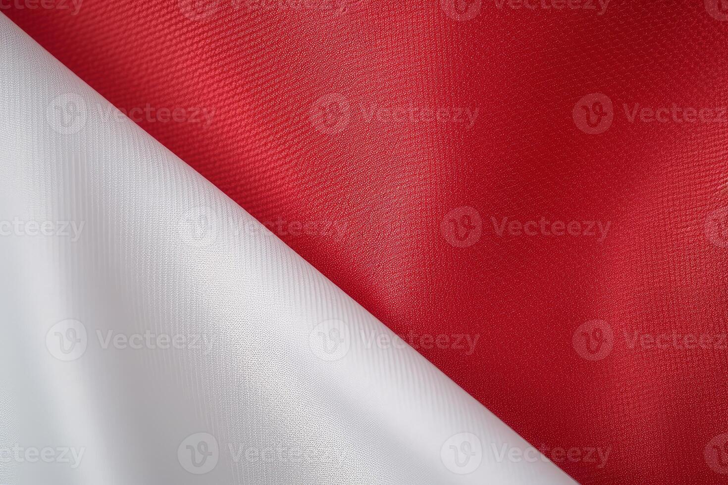 Red and white diagonal satin fabric background creating an elegant contrast photo