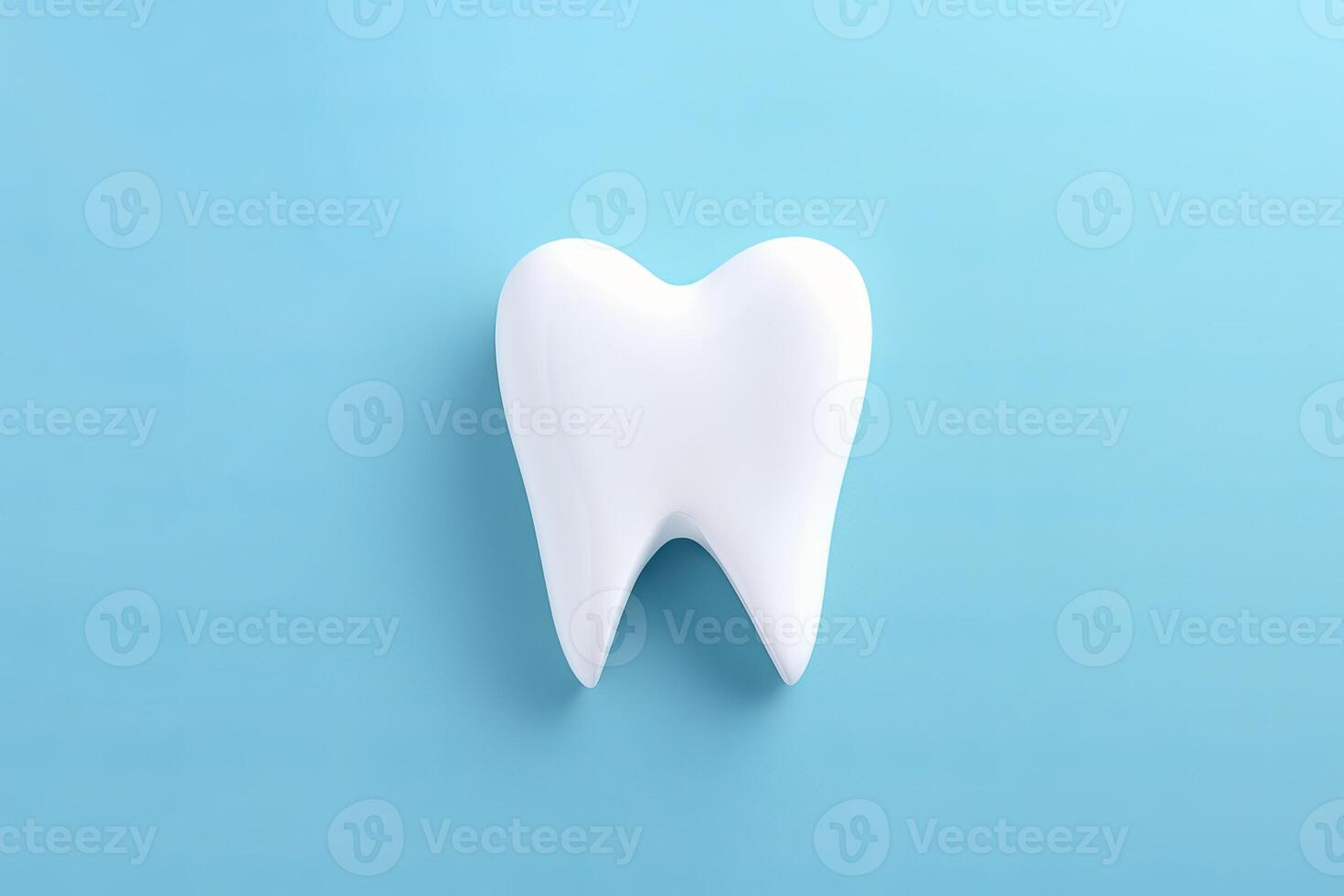 White tooth model lying on blue background symbolizing oral hygiene photo