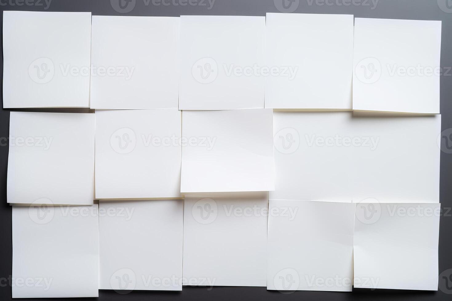 Blank sticky notes forming a grid on a gray background photo