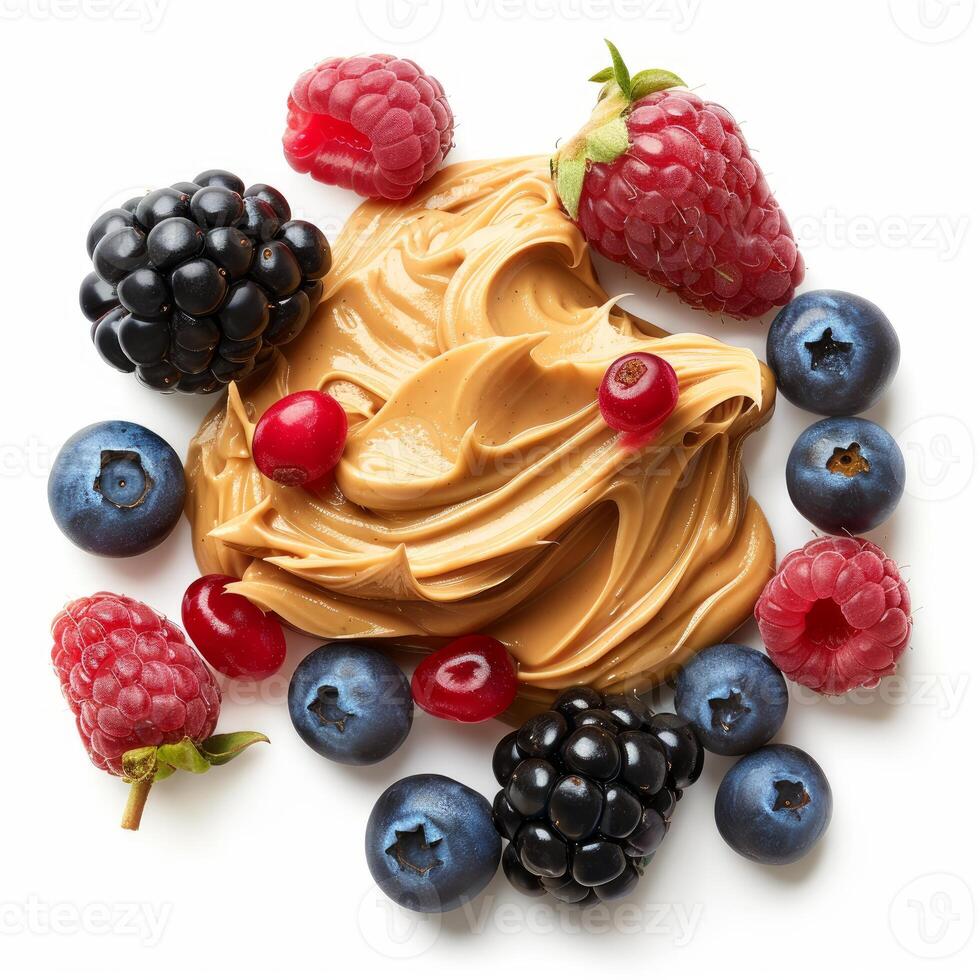 Creamy peanut butter surrounded by fresh berries and redcurrants on white background photo