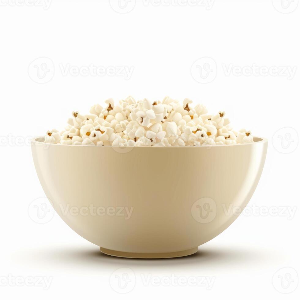 Bowl overflowing with freshly popped popcorn on white background photo