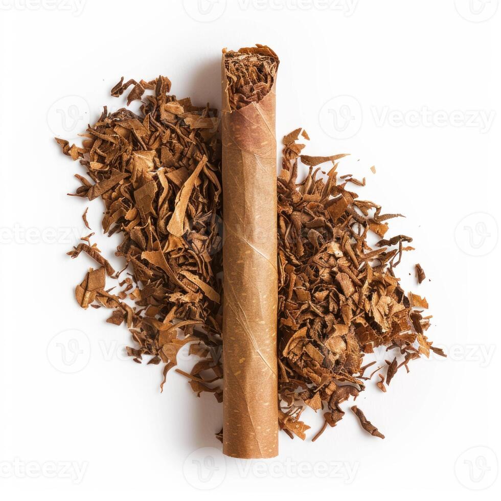 Handmade cigar resting on pile of dried tobacco leaves on white background photo