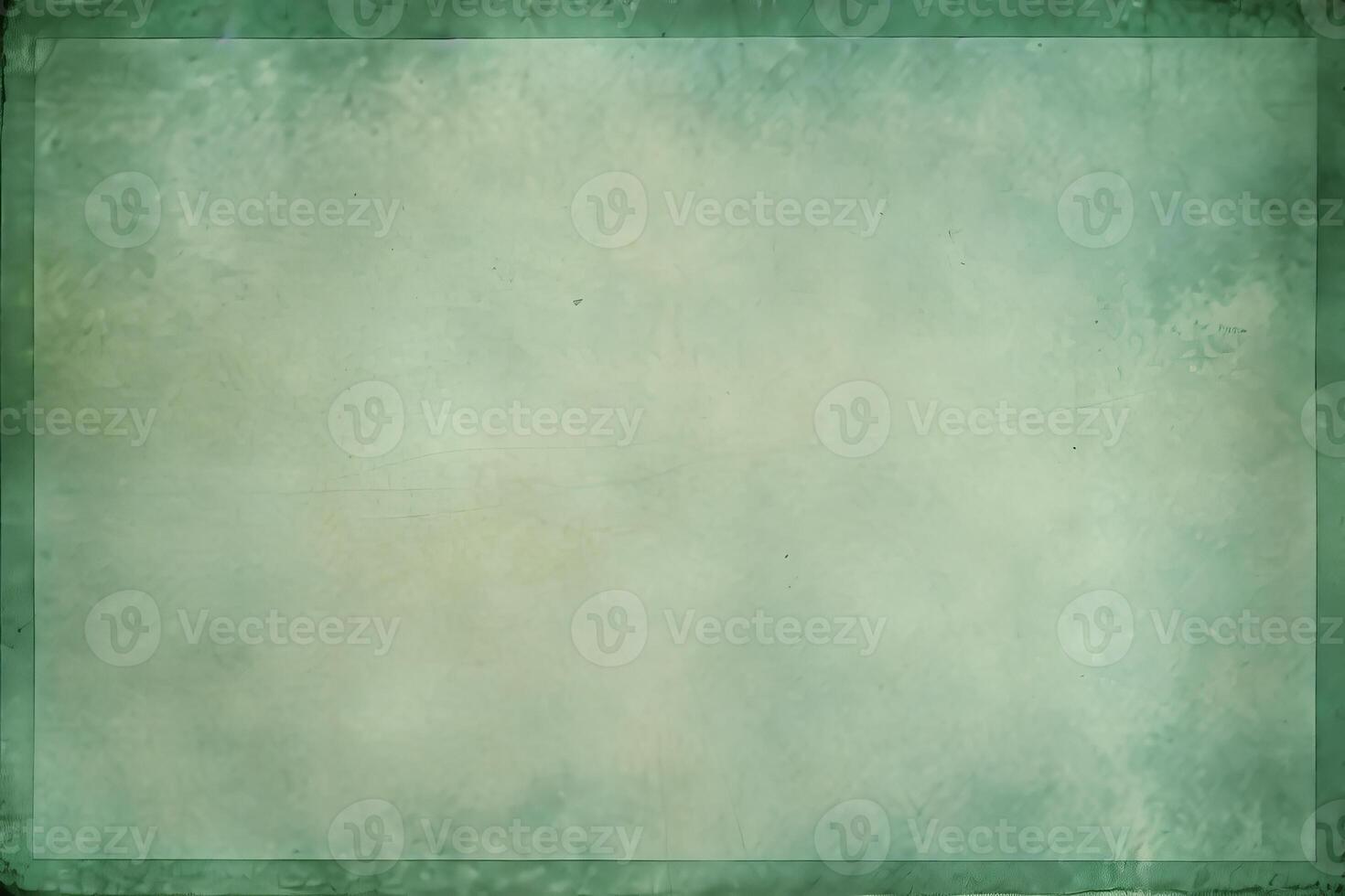 Green grunge background texture with dark border creating vintage design element photo