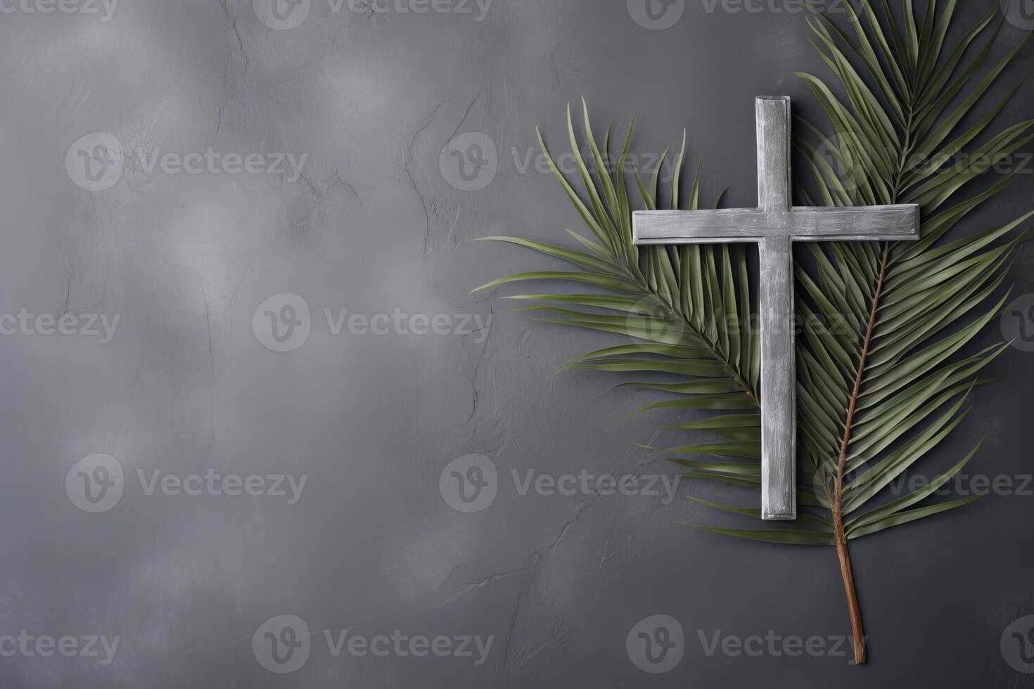 Wooden cross resting on palm leaves symbolizing palm sunday photo