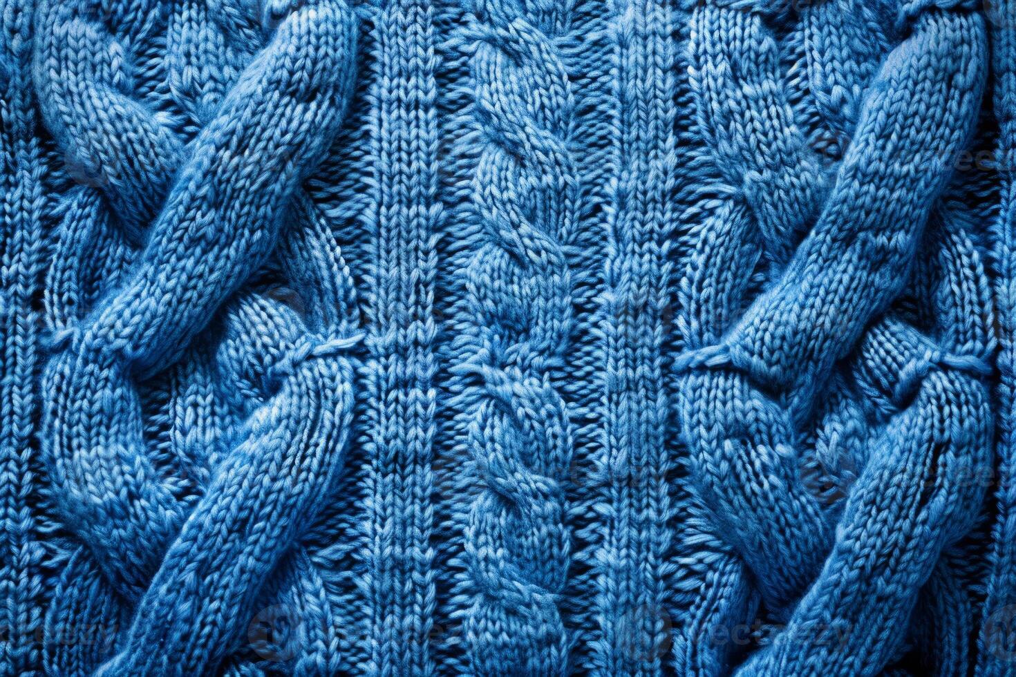 Cable knit fabric texture creating cozy blue background for winter projects photo