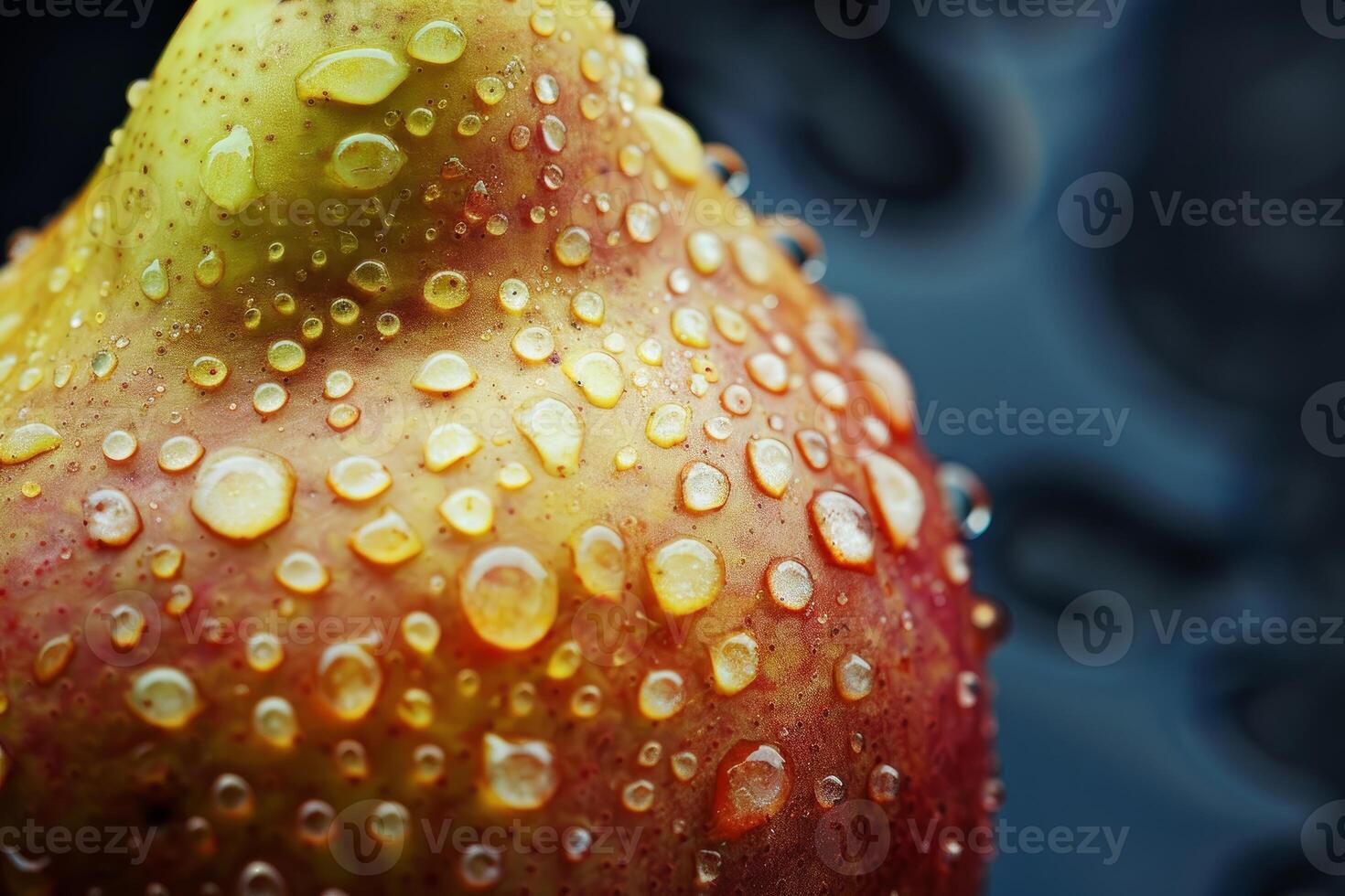 Ripe pear covered with water droplets on dark background photo