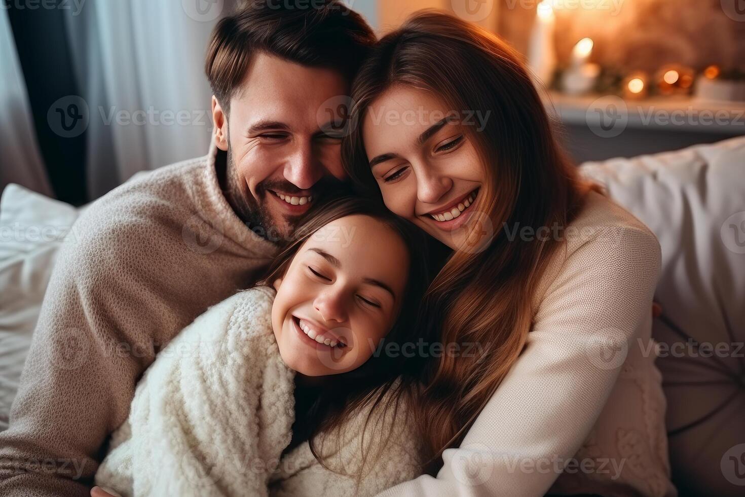 Happy family embracing and smiling together at home photo