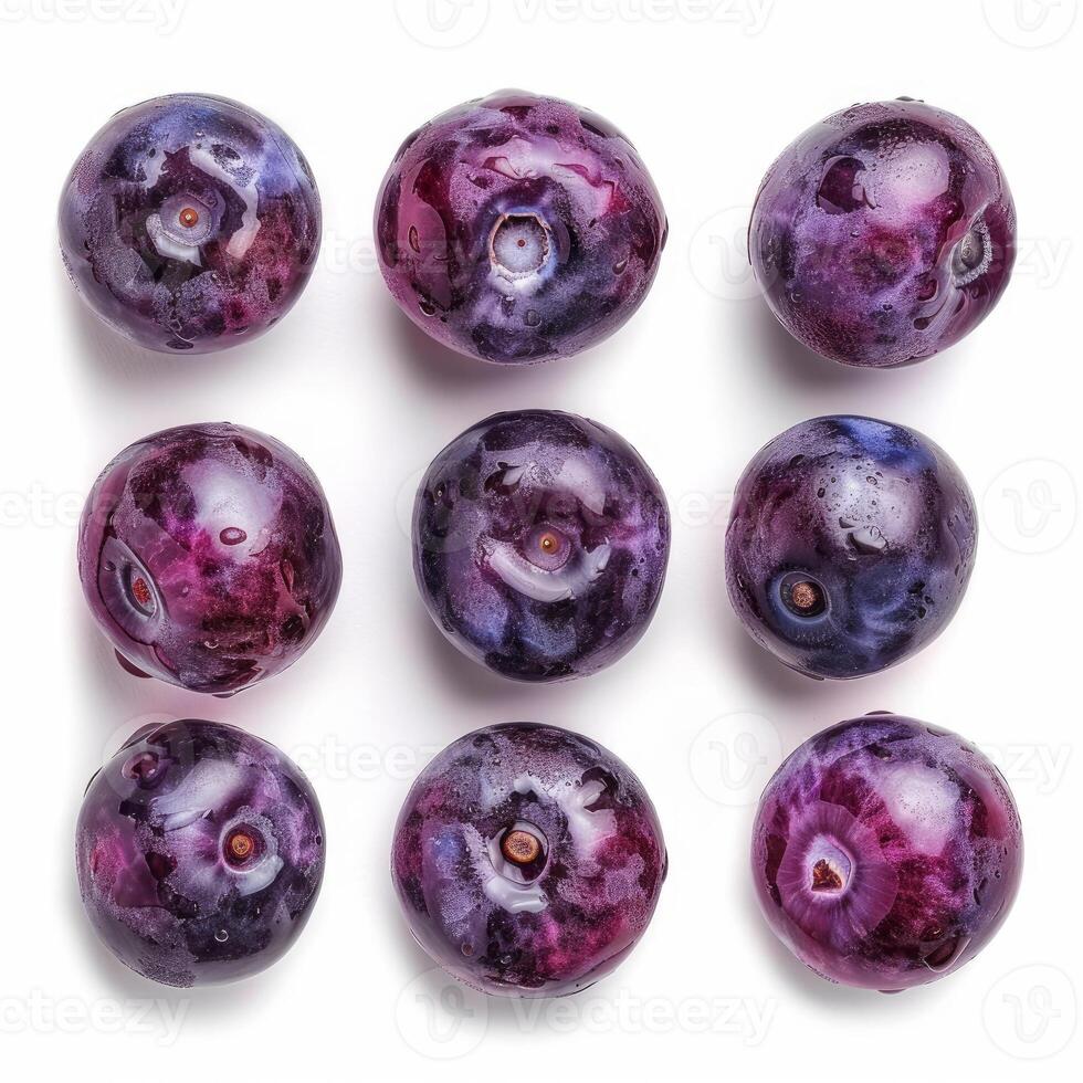 Fresh ripe wet blueberries arranged in grid pattern on white background photo