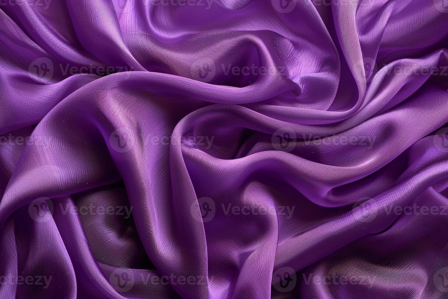 Purple fabric flowing and waving with highlights and shadows creating an abstract background photo