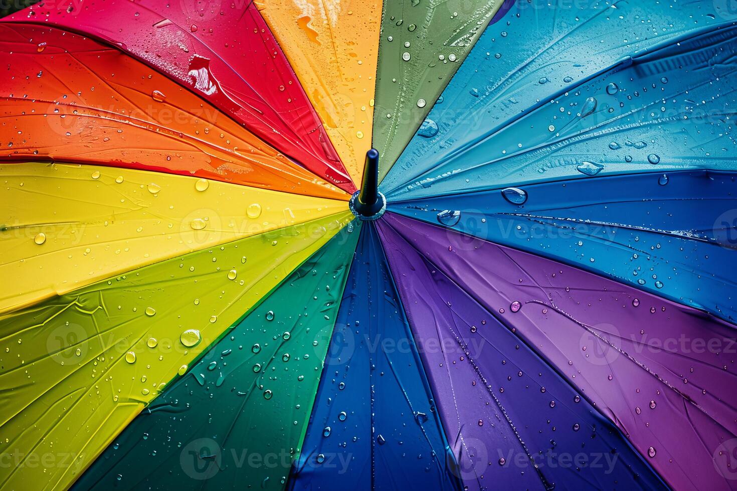 Colorful rainbow umbrella protecting from rain with water droplets photo