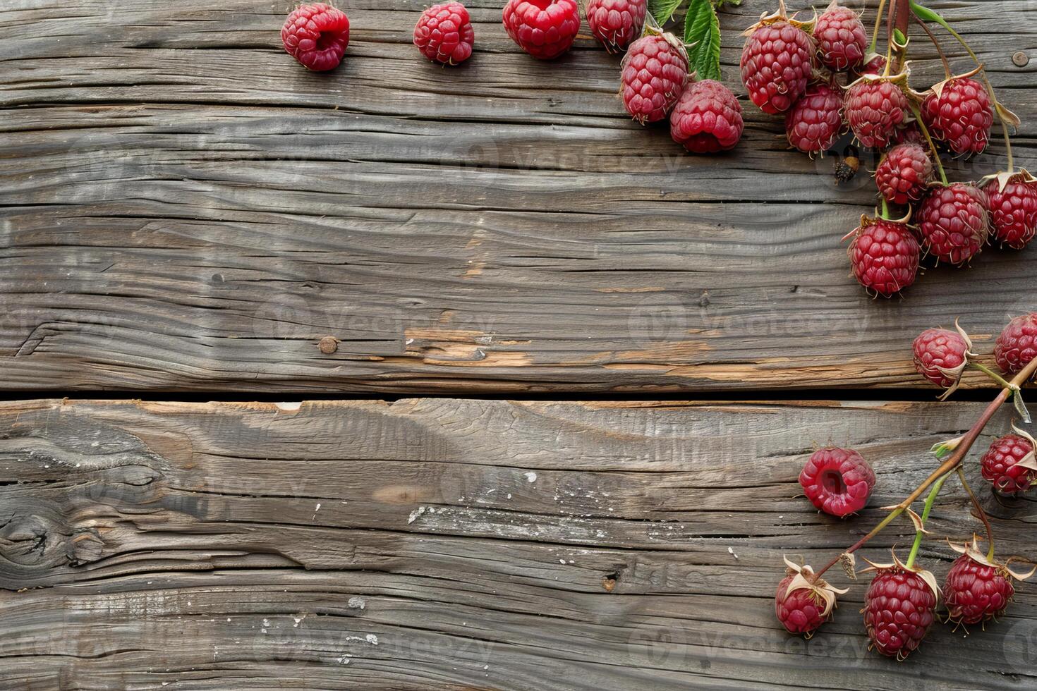 Fresh raspberries lying on rustic wooden table background photo