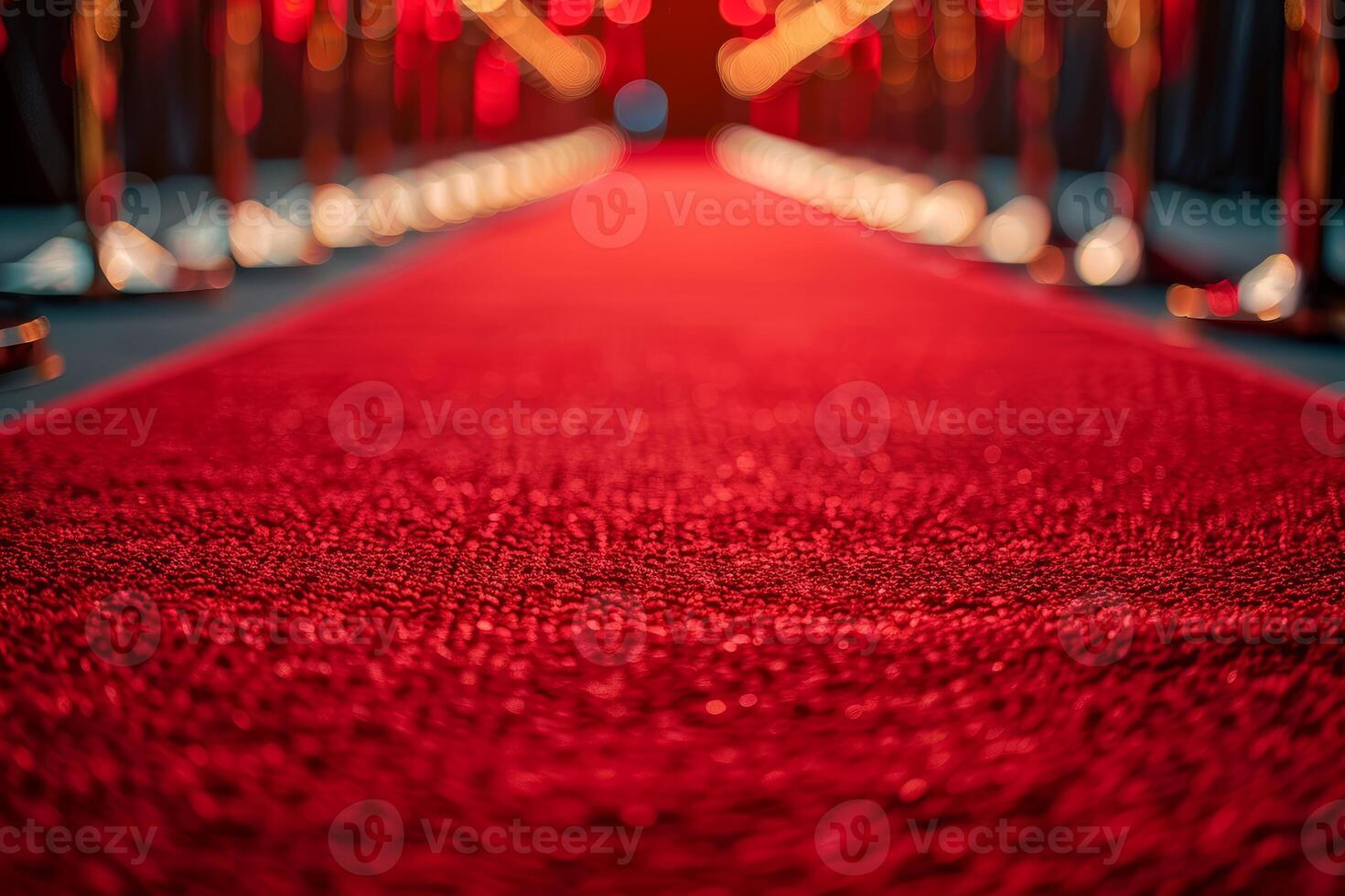 Red carpet leading to blurred lights representing success and achievement photo