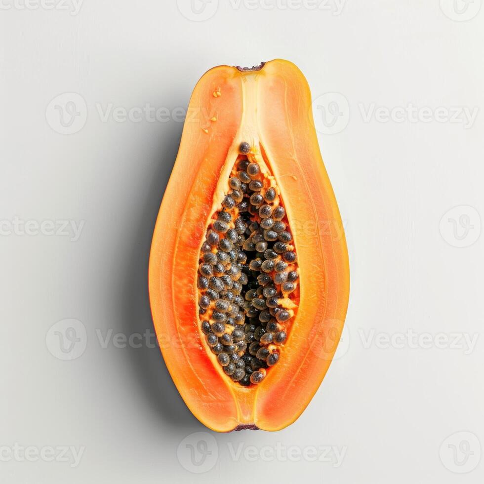 Fresh papaya showing seeds on white background photo